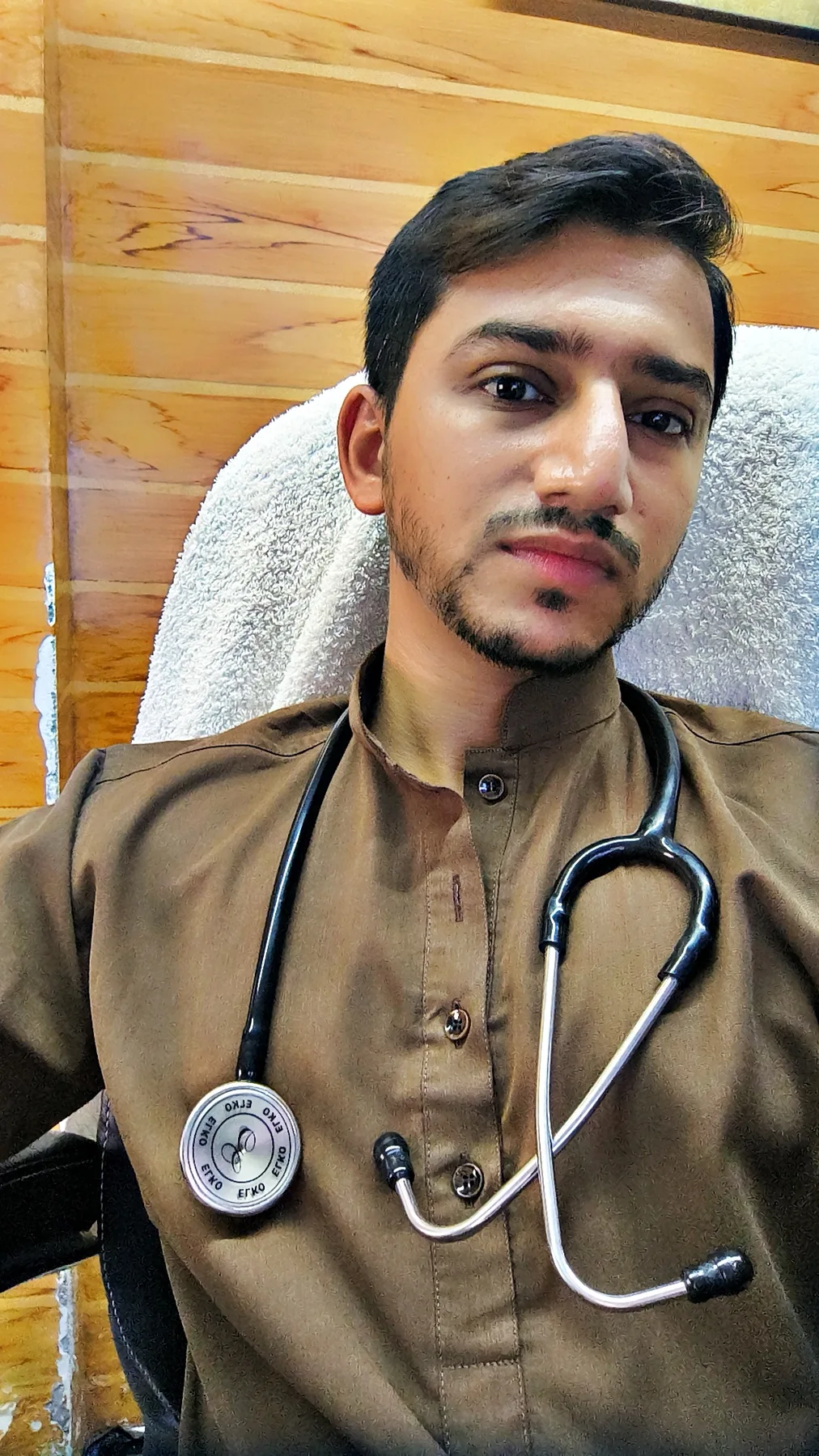 Arbaz Shaikh in a doctor's coat with stethoscope